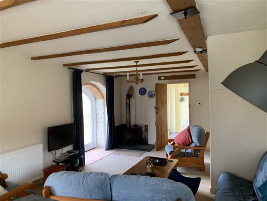 Sitting area with Log Burner and french doors